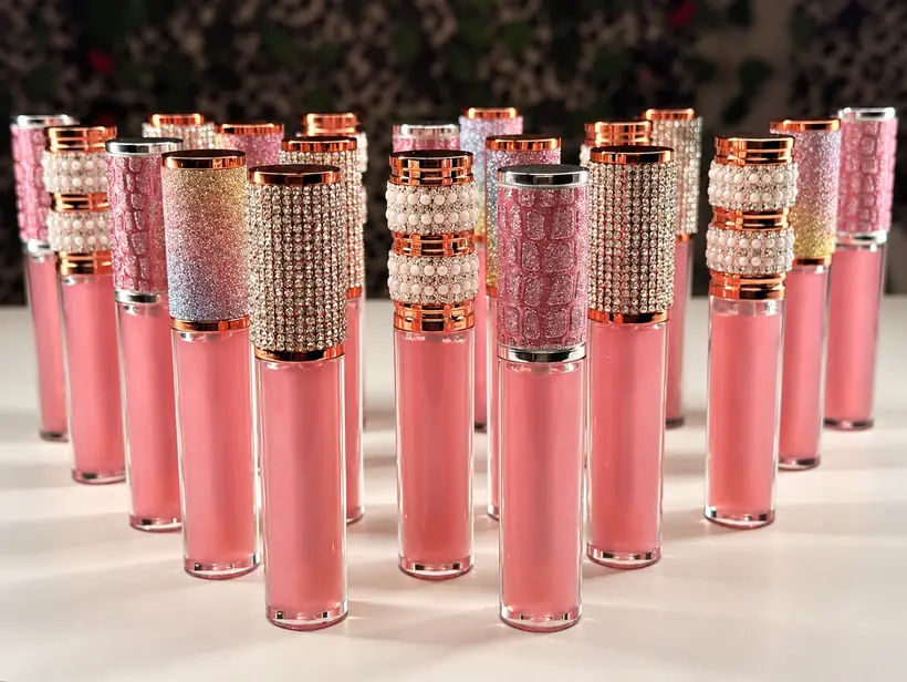 Angel Oh Luxe pink lip glosses with jeweled and pearl caps